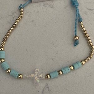 Gold and Blue Beaded adjustable Bracelet w white iridescent cross NWT.